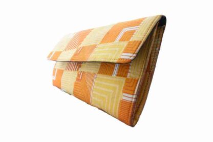 yellow, orange and beige african wax print clutch bag