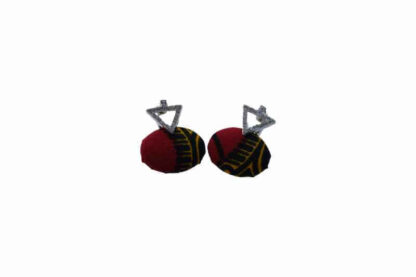 red and black oval shaped african wax print earrings with a silver triangle clasp