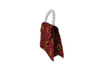 red, orange and black african wax print tote bag with faux pearl handle